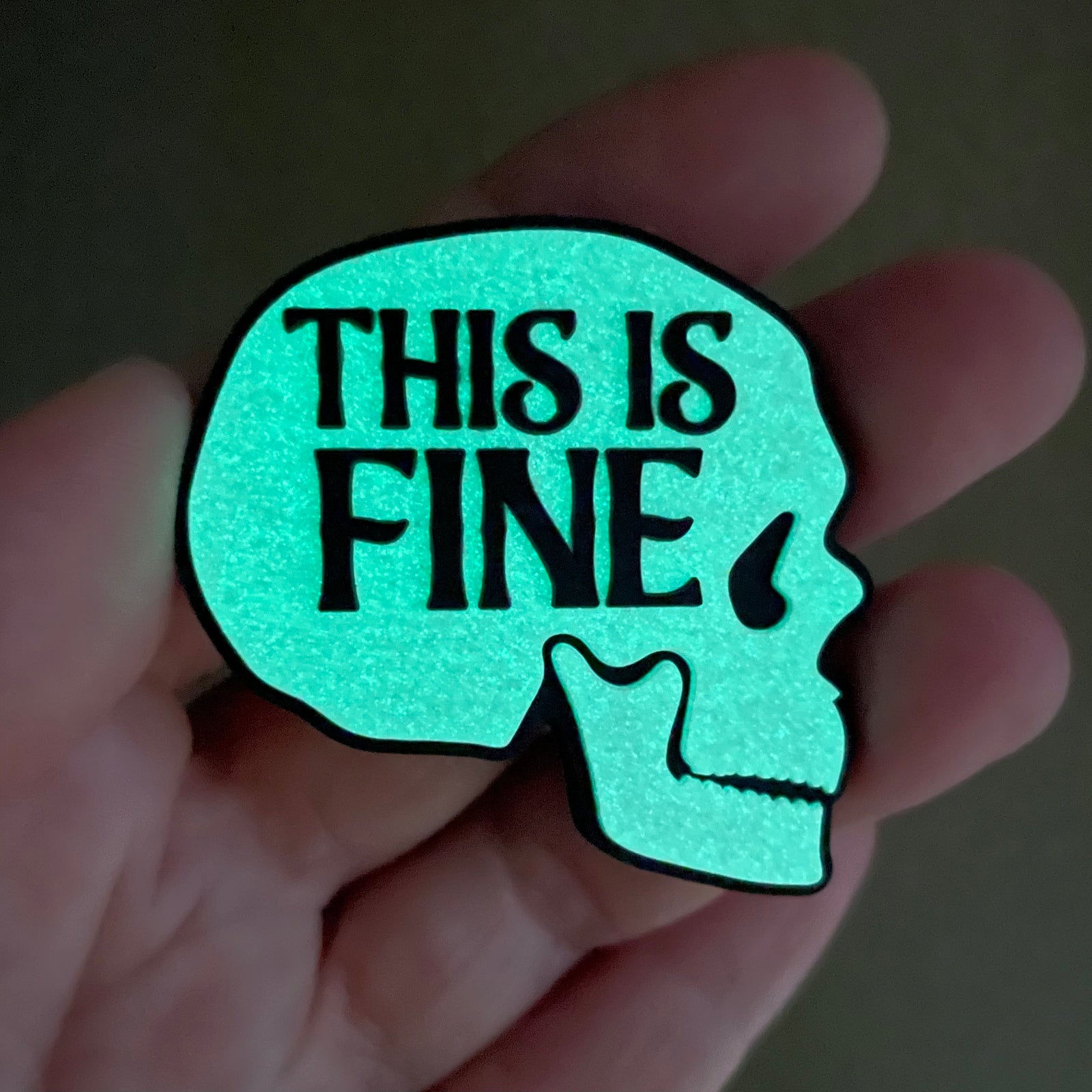 Skull with 'This is Fine' text on a gradient background