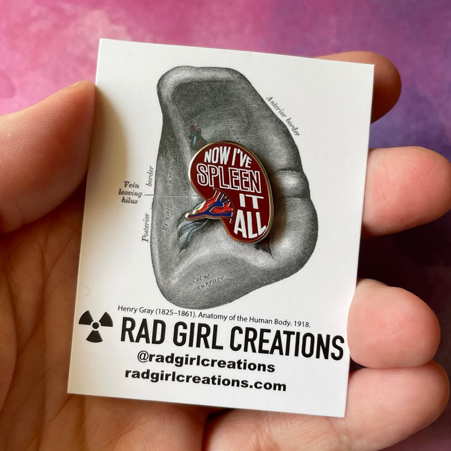 Pin with speech bubble design and text 'NOW I'VE SPLEEN IT ALL' on a gray background