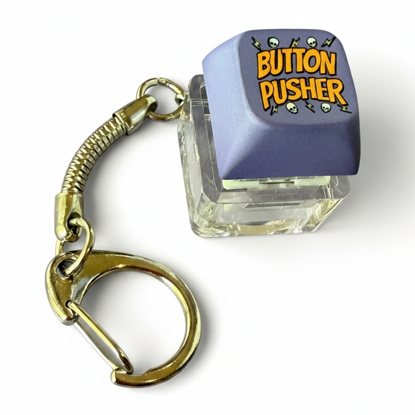 Keychain with a purple button labeled 'Button Pusher' on a white background