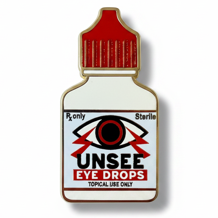 Pin with 'UNSEE Eye Drops' design on a white background