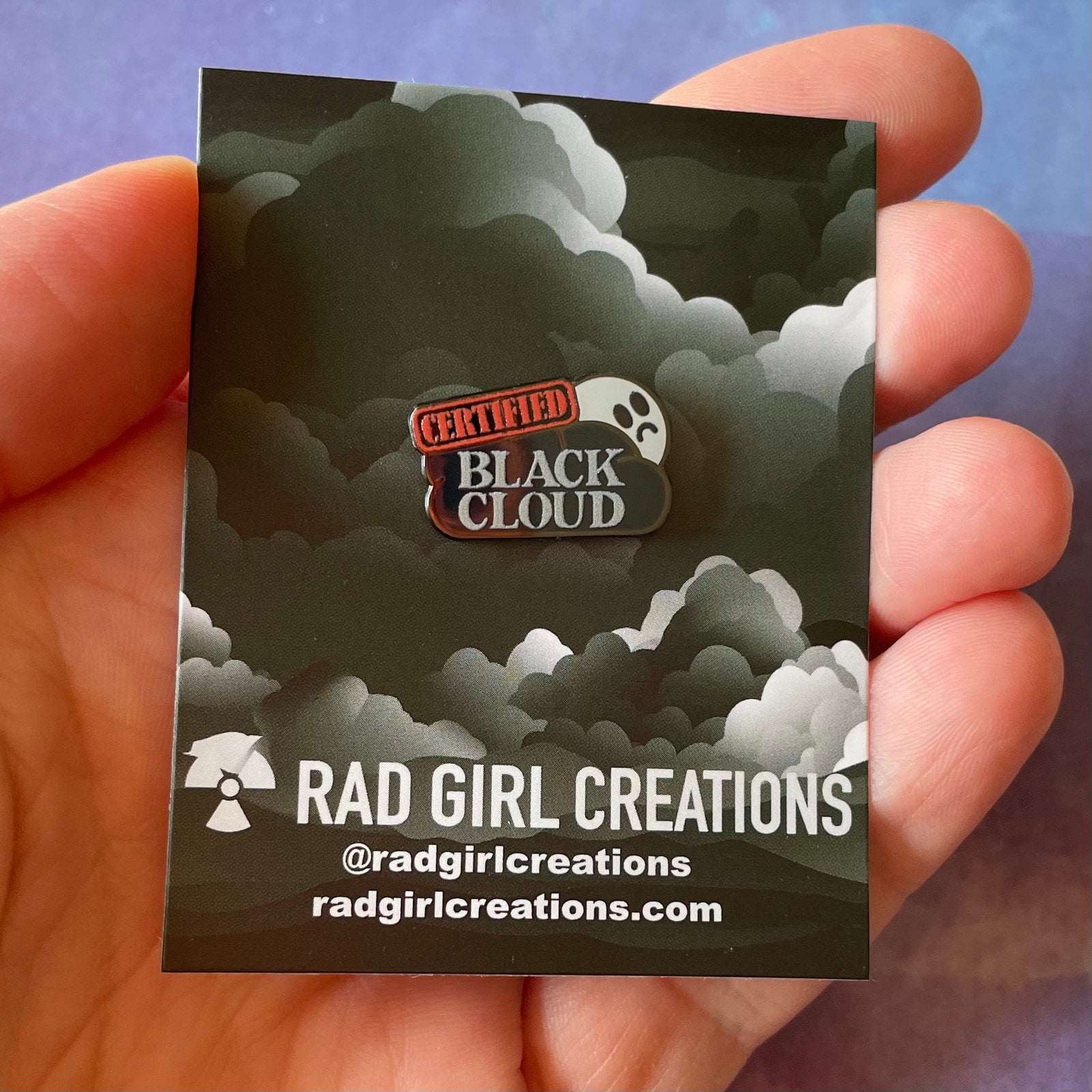 Pin with 'Certified Black Cloud' text on a white background