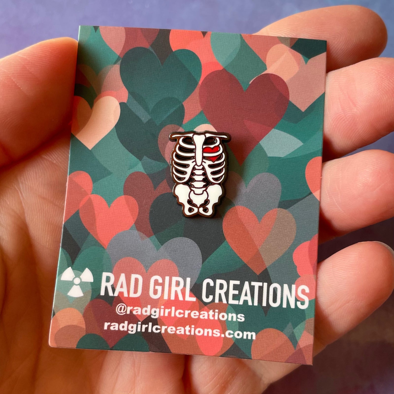 Skeletal design with a red heart on a gray background