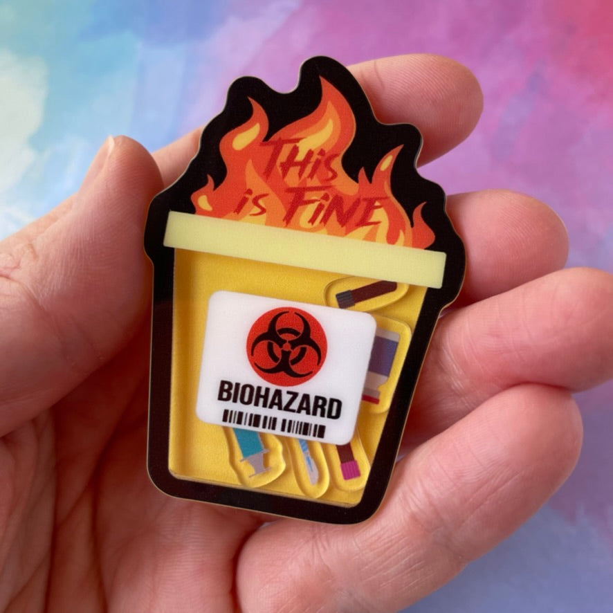 Biohazard container with flames and 'This is fine' text on a white background