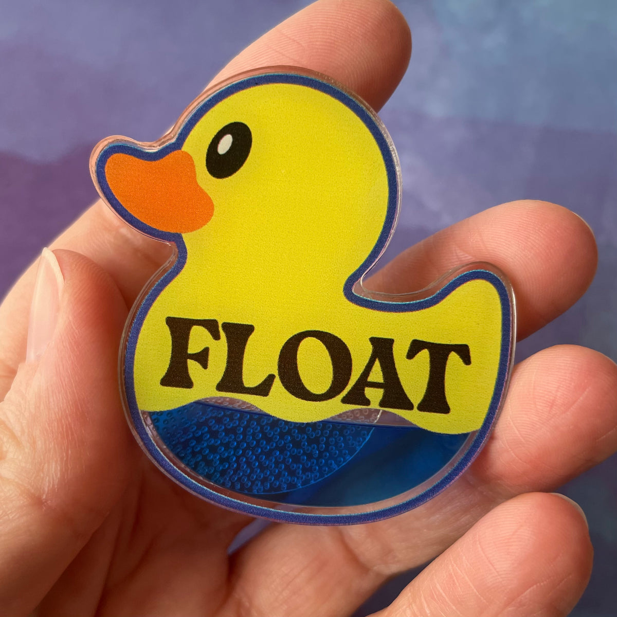We All Float Badge Reel