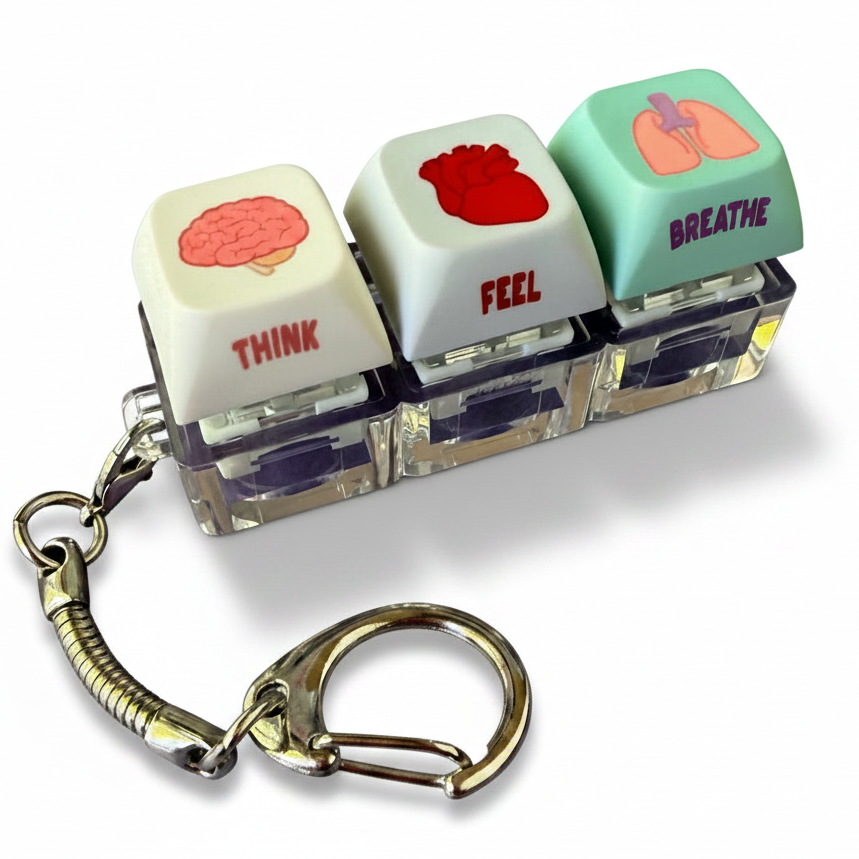 Keychain with three key-shaped pendants labeled 'Think', 'Feel', and 'Breathe' on a white background.