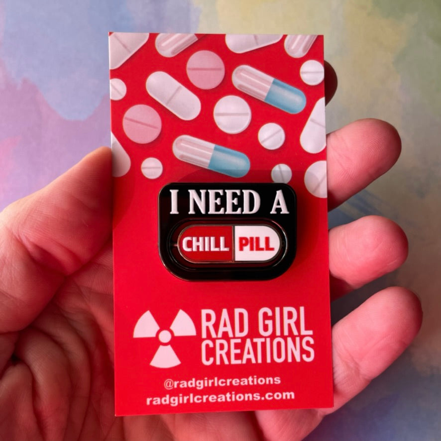 Pin with 'I Need a Happy Pill' text on a white background