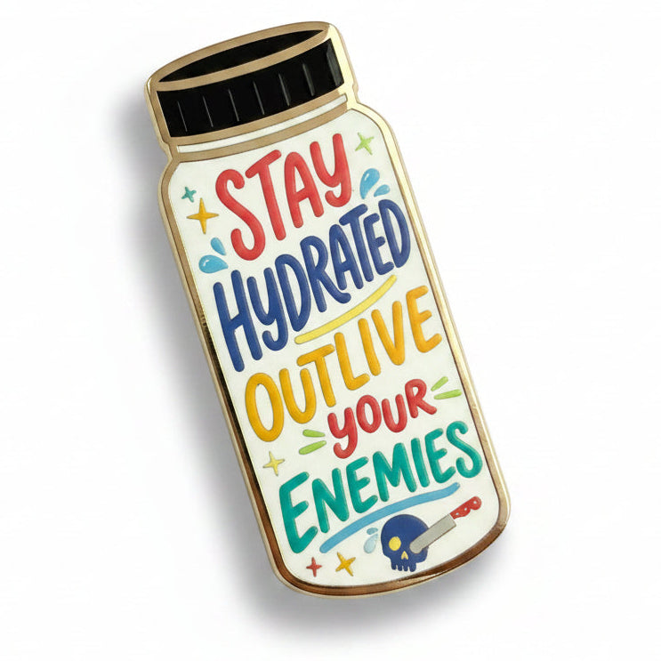 Enamel pin with motivational quote 'Stay Hydrated Outlive Your Enemies' on a white background